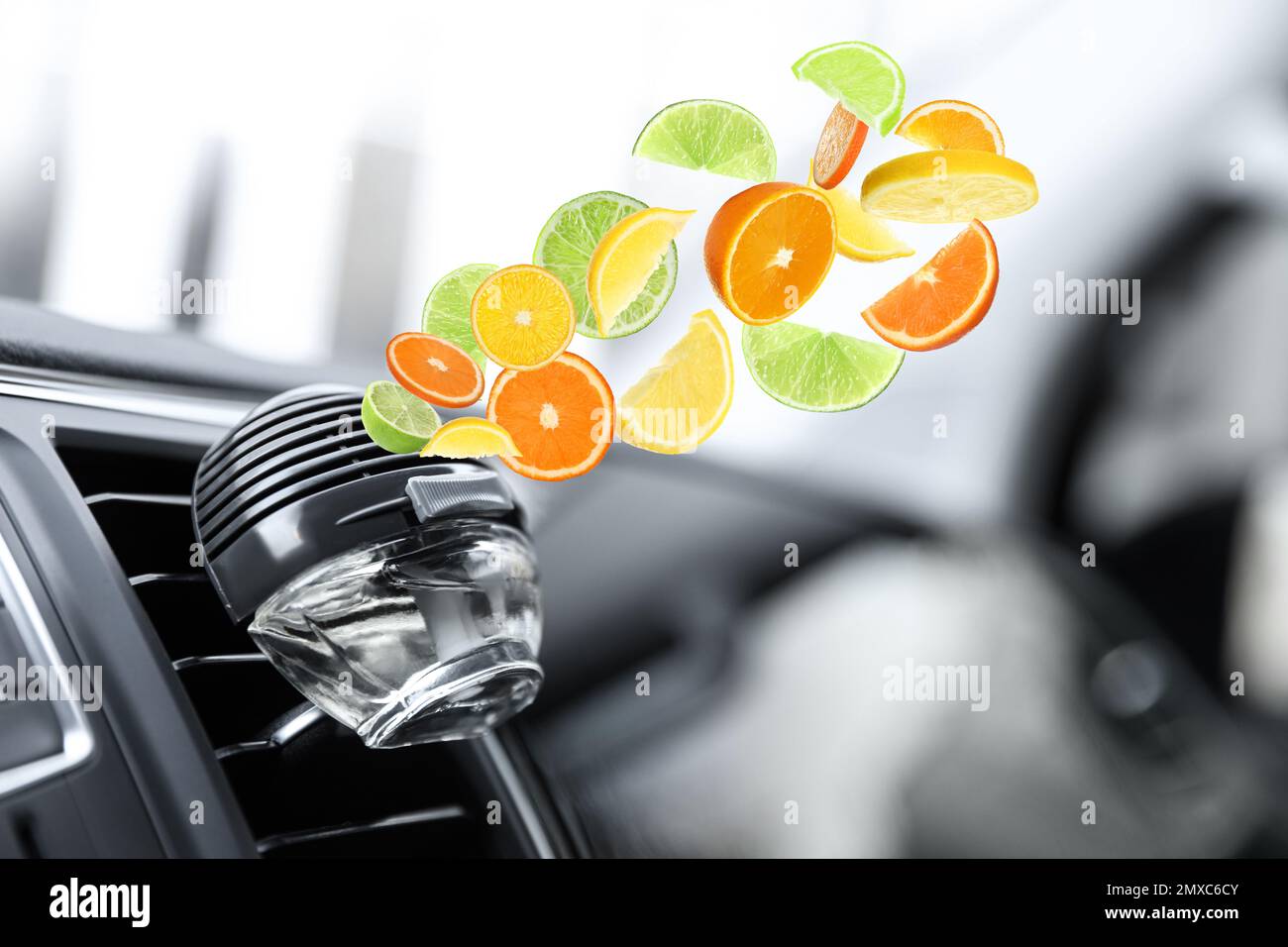 Air freshener clip attached to car ventilation. Citrusy aroma Stock