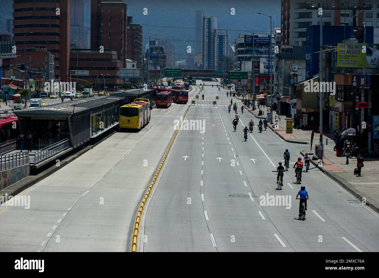 Bogota's public bus system 'Transmilenio' runs along Bogota's 'Ciclovia' during the 'No Car Day' in Bogota, Colombia in which private cars and vehicles including motorcicles are banned to improve the cities air and pollution, on February 2, 2023.  Photo by: Chepa Beltran/Long Visual Press Stock Photo