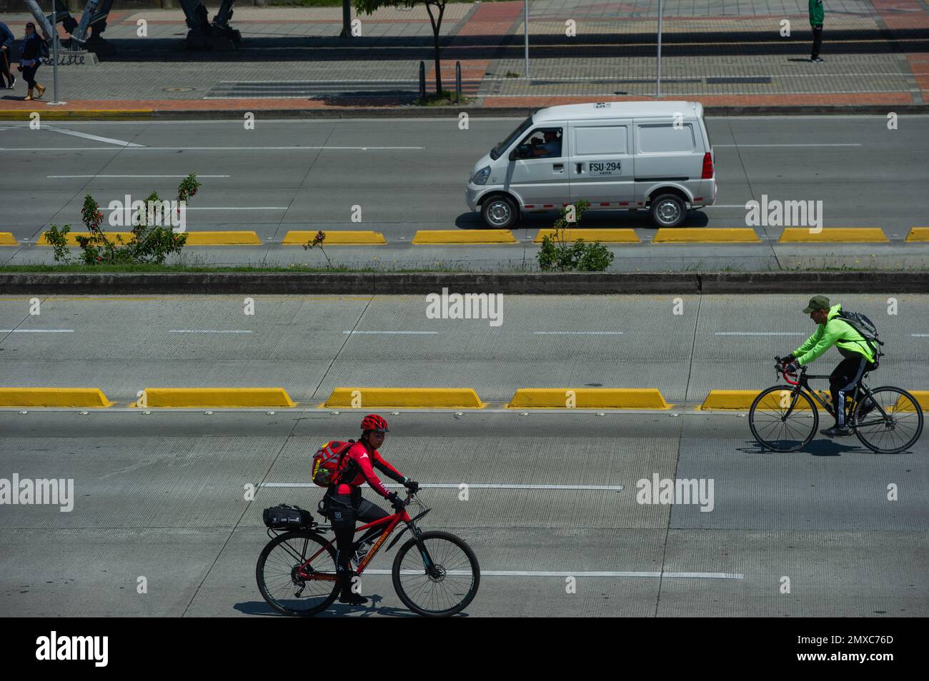 People commute in the bicycles during the 'No Car Day' in Bogota, Colombia in which private cars and vehicles including motorcicles are banned to improve the cities air and pollution, on February 2, 2023.  Photo by: Chepa Beltran/Long Visual Press Stock Photo