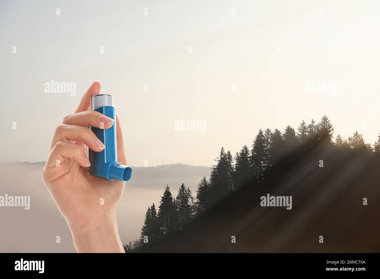 Woman with asthma inhaler in mountains, closeup. Emergency first aid during outdoor recreation Stock Photo