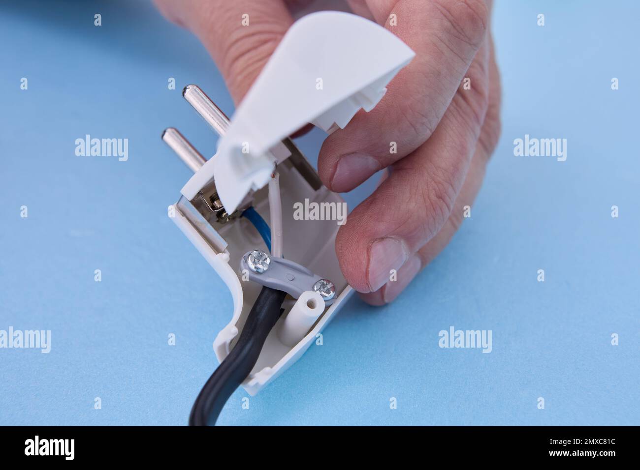 Installation of sectional European electric plug on an electrical cord