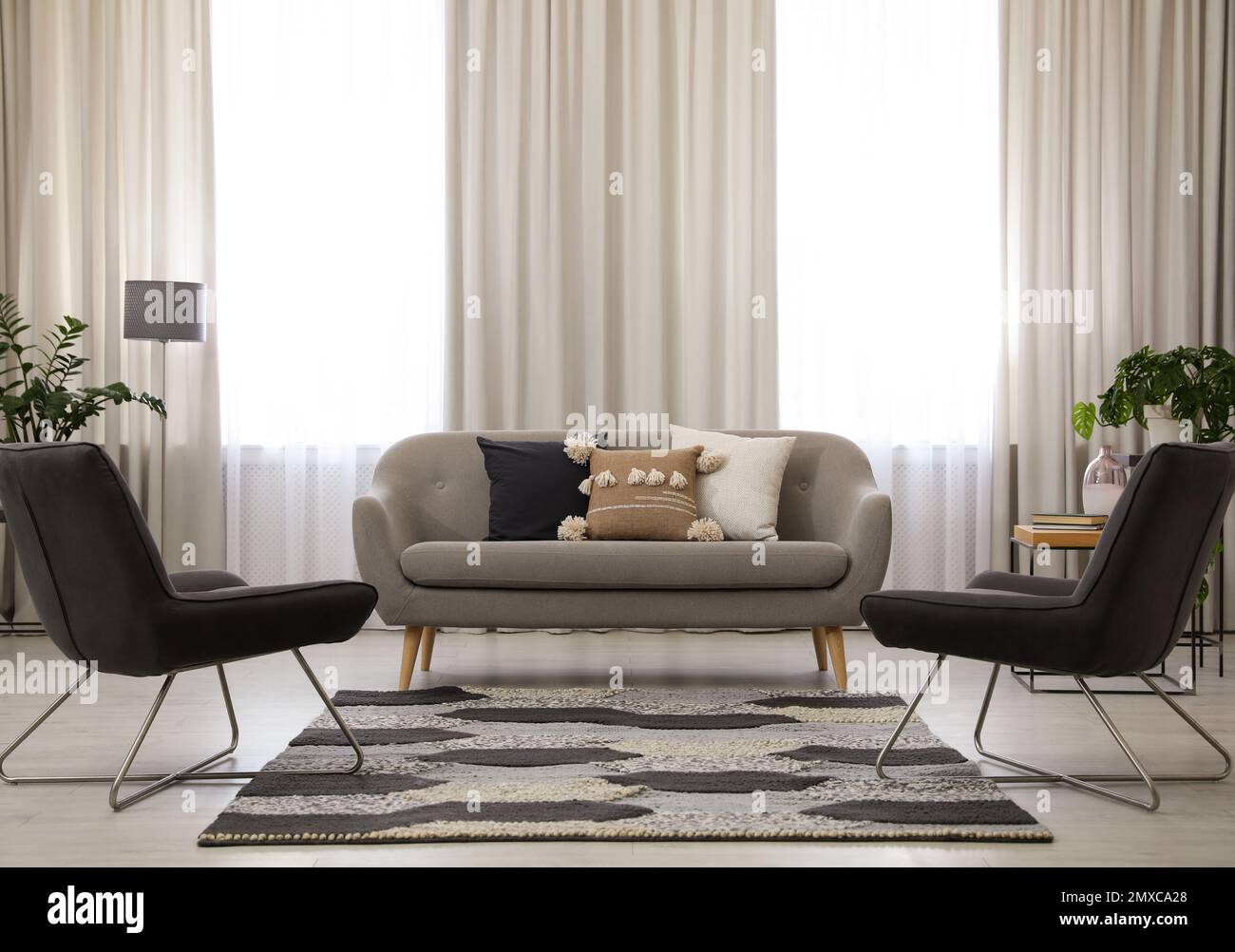 Modern living room interior with comfortable sofa and armchairs Stock ...