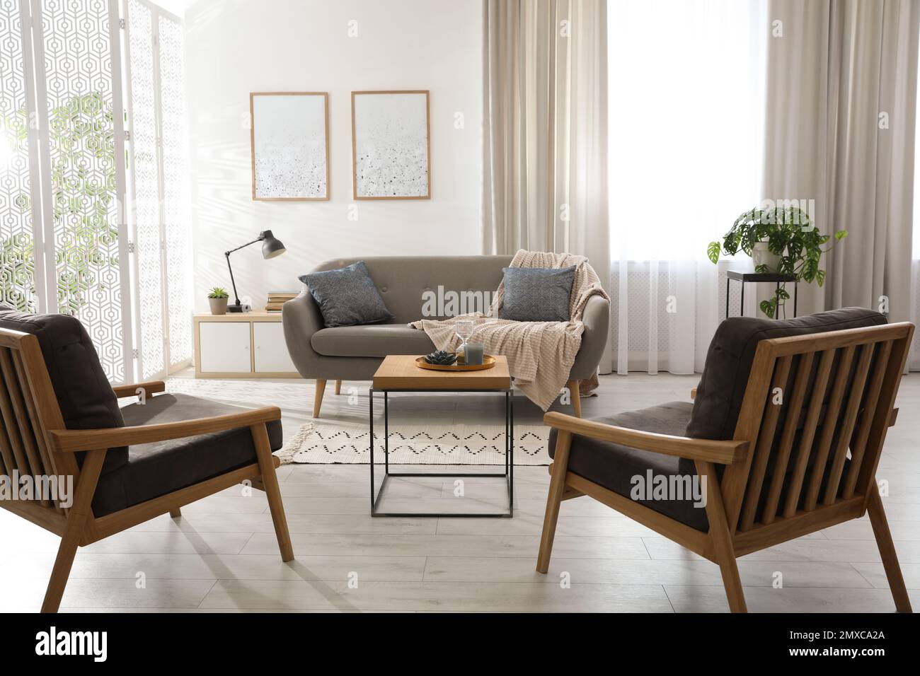 Modern living room interior with comfortable sofa and armchairs Stock ...