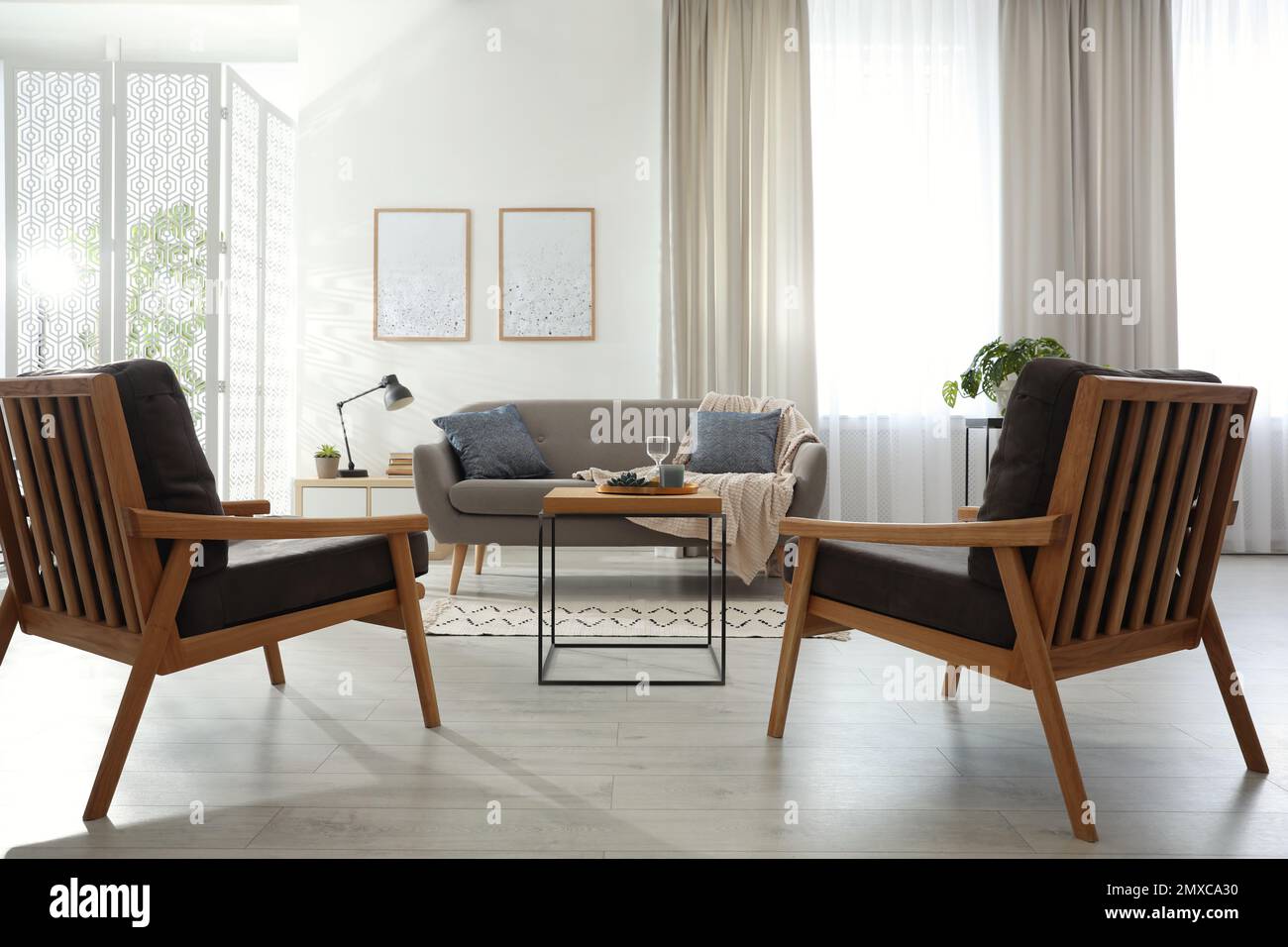 Modern living room interior with comfortable sofa and armchairs Stock ...