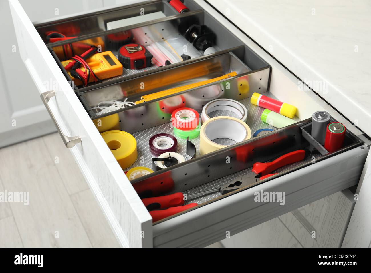 Set of instruments in open desk drawer indoors Stock Photo Alamy