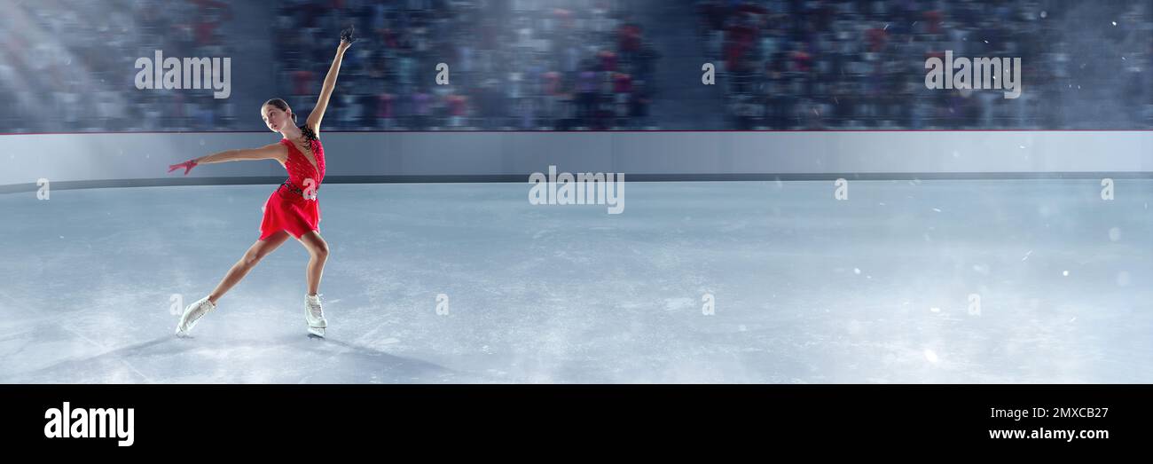 Beautiful girl in red dress, professional figure skater performing on