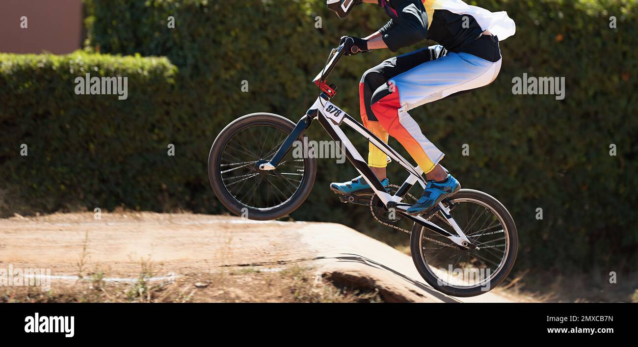 BMX rider competing in the child class on the offroad circuit Stock
