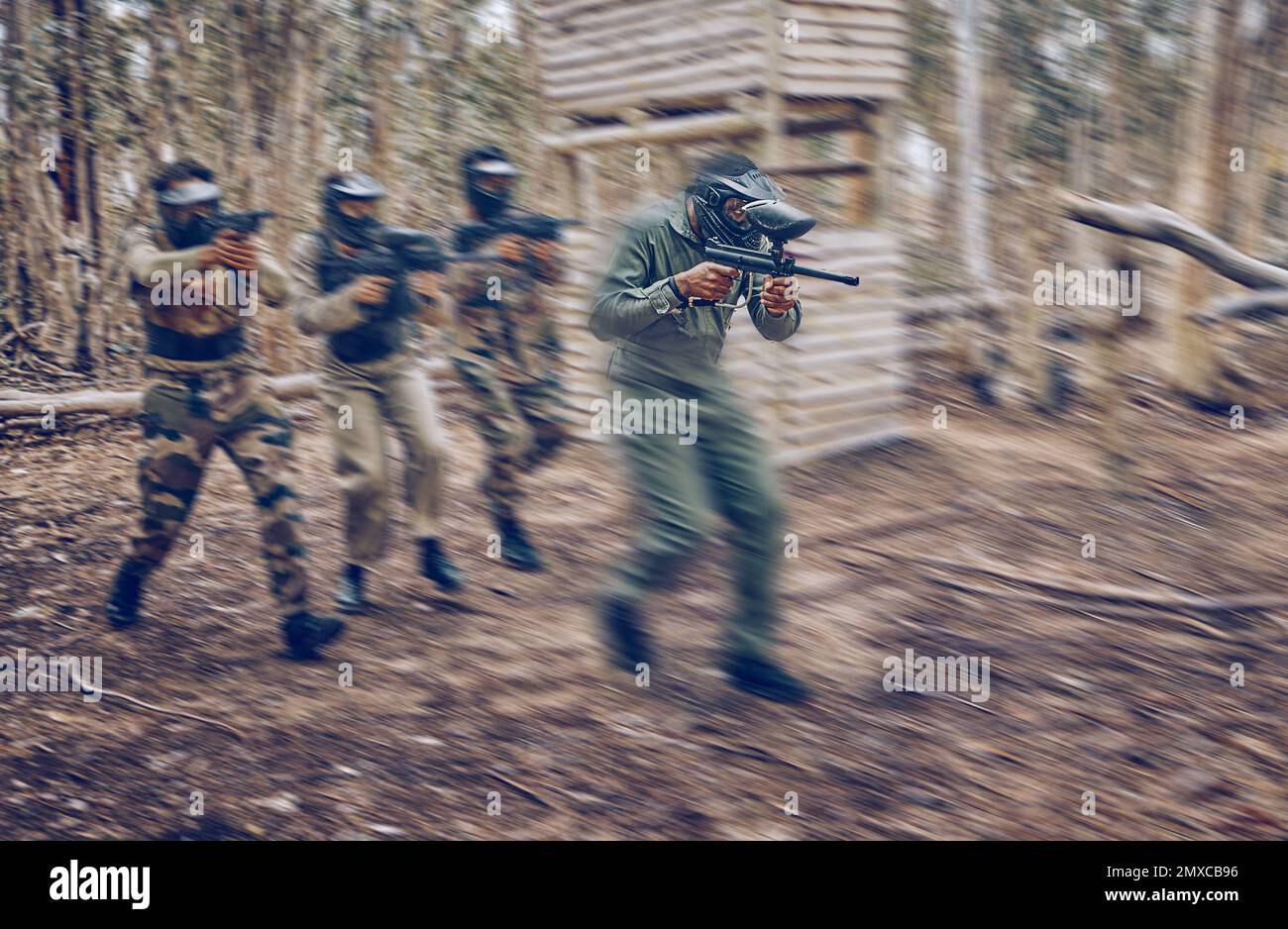 Paintball, team work or men running in a shooting game with speed or fast action on a fun battlefield
