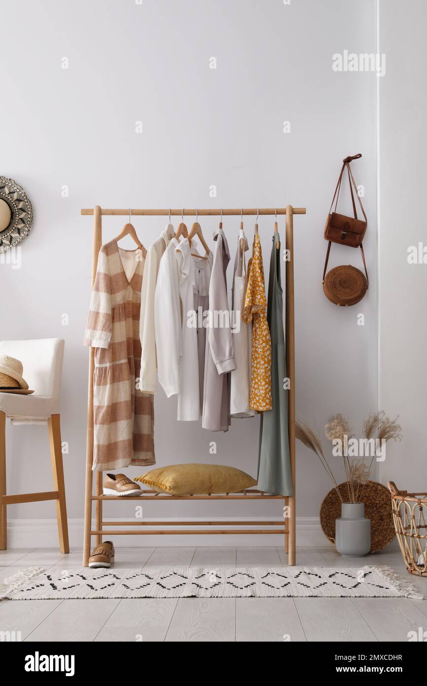 https://c8.alamy.com/comp/2MXCDHR/rack-with-stylish-womens-clothes-indoors-interior-design-2MXCDHR.jpg