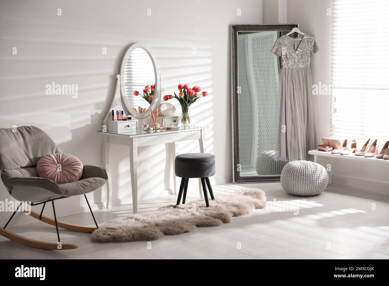 Stylish room interior with elegant dressing table and mirror Stock
