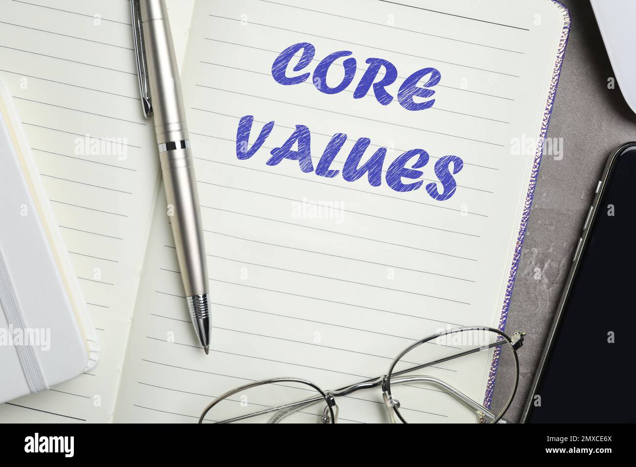 Core values concept. Flat lay composition with stationery on dark table Stock Photo
