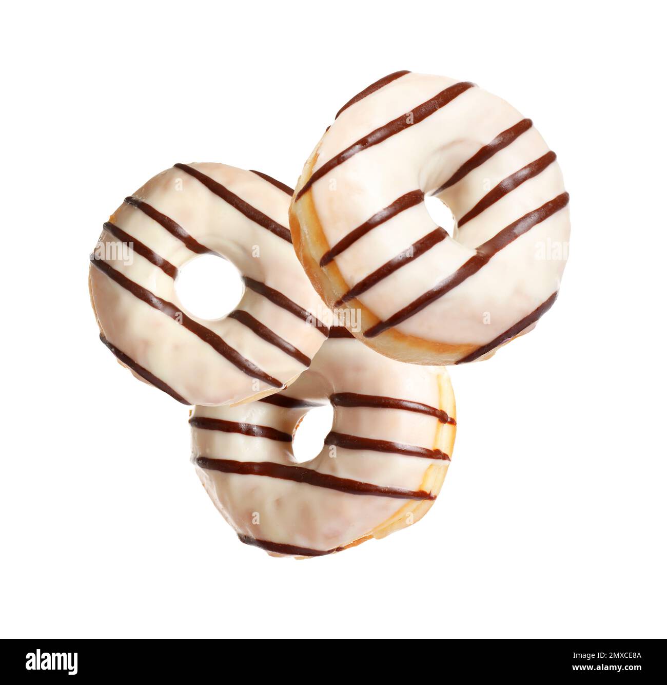 Set of falling delicious donuts on white background Stock Photo