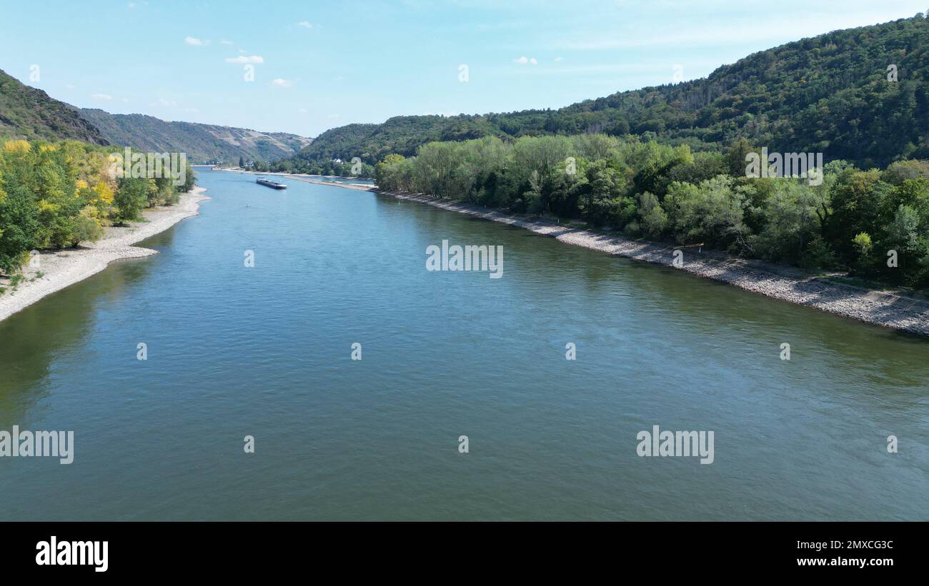 An aerial view of a river stream splitting into two by a small island
