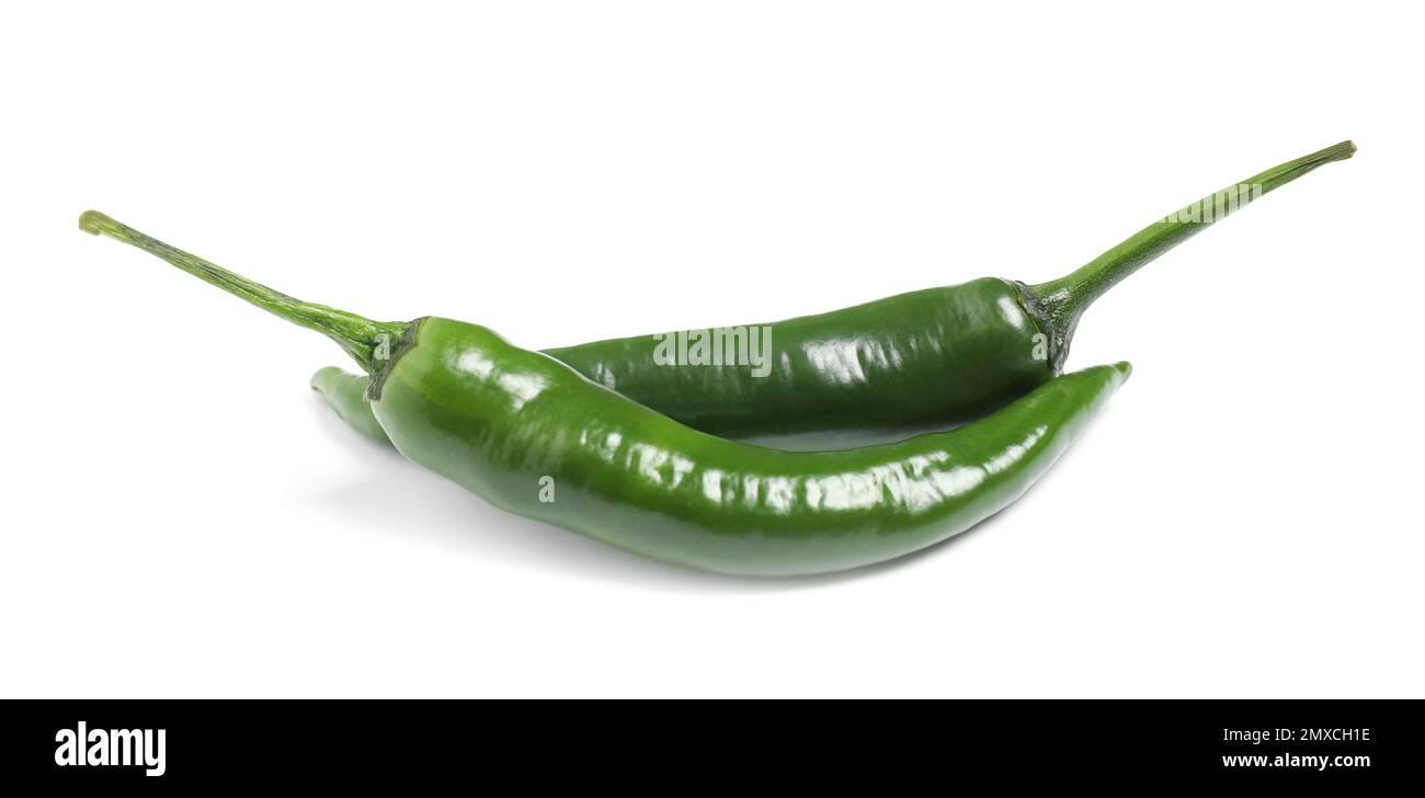 Green hot chili peppers on white background Stock Photo - Alamy