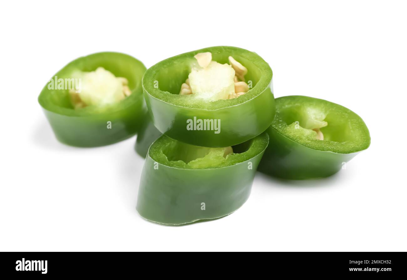 Cut green hot chili pepper on white background Stock Photo - Alamy