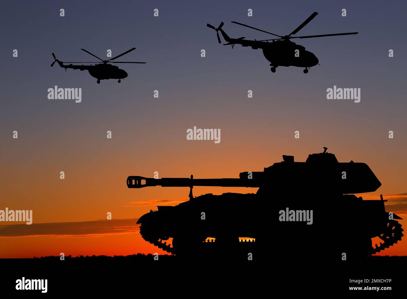 Silhouettes of army tank and helicopters at sunset outdoors. Military