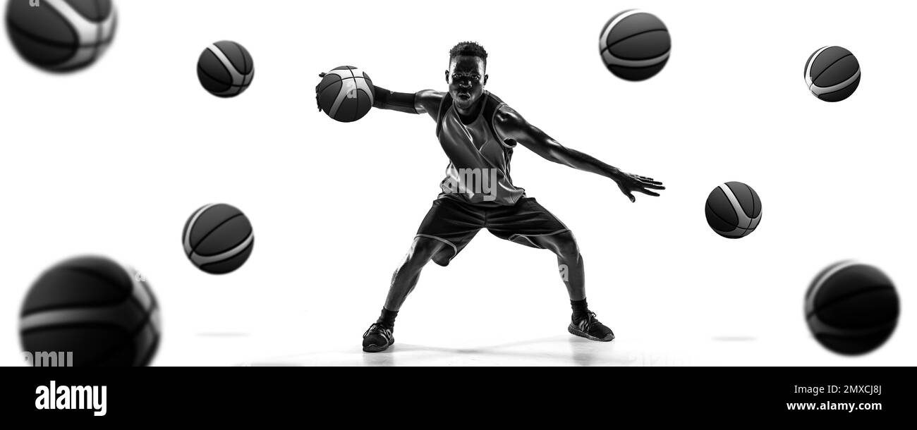 Collage. Black and white. African man, professional basketball player dribbling ball over white background with many balls Stock Photo