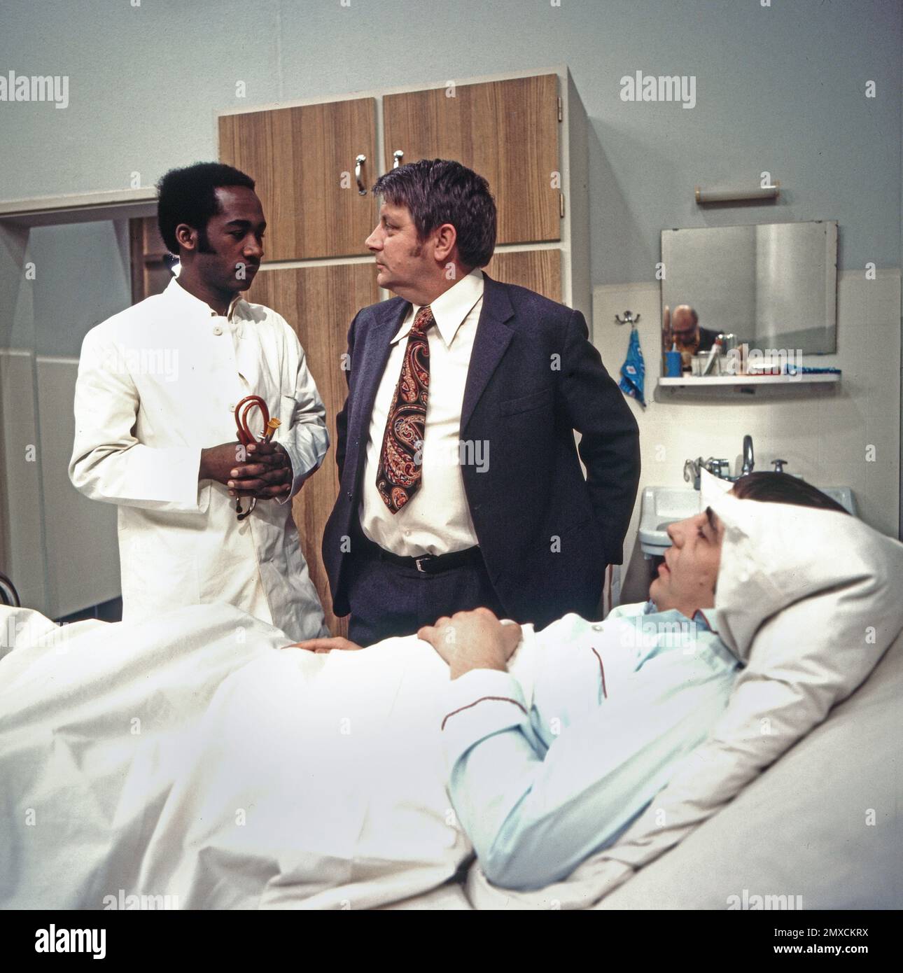 1970s doctor patient hi-res stock photography and images - Alamy