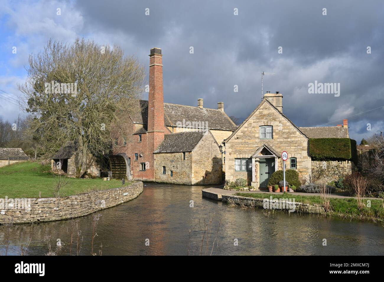 The Old Mill which stands on the River Eye in the Cotswold village of Lower Slaughter, Gloucestershire Stock Photo