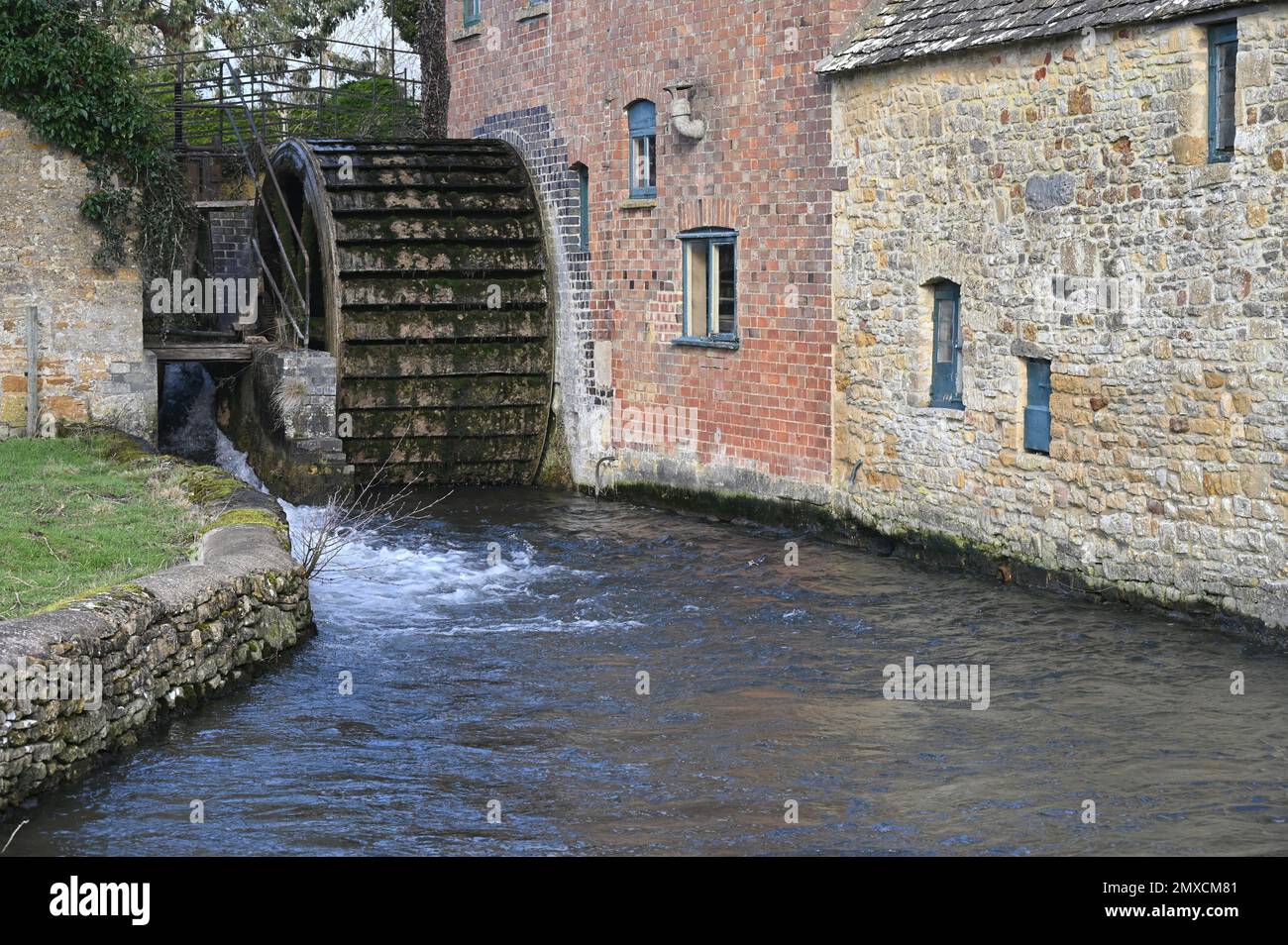 The Old Mill which stands on the River Eye in the Cotswold village of Lower Slaughter, Gloucestershire Stock Photo