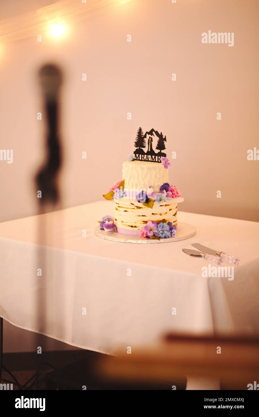 A vertical shot of a small wedding cake Stock Photo