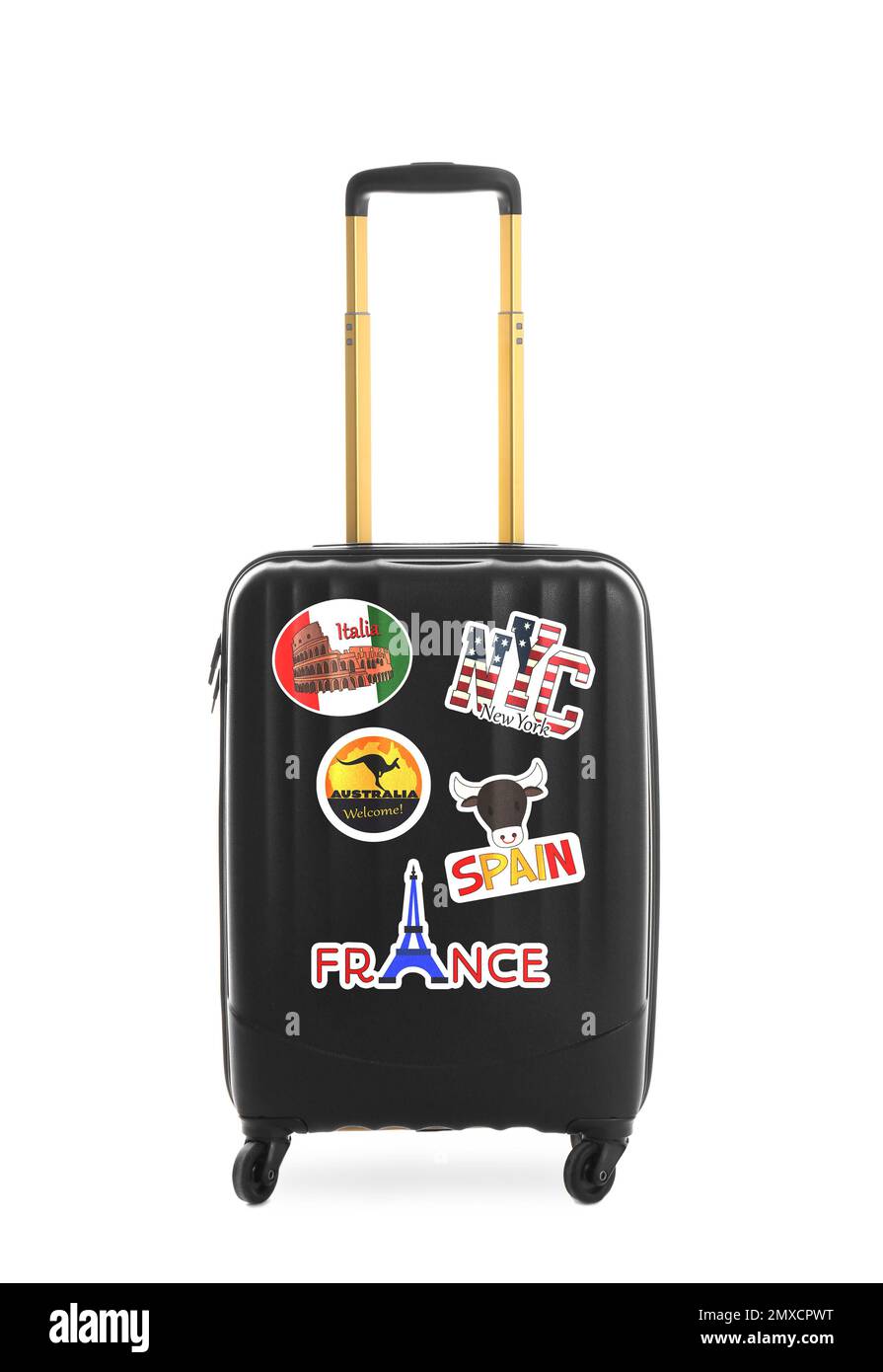 Modern suitcase with travel stickers on white background Stock Photo