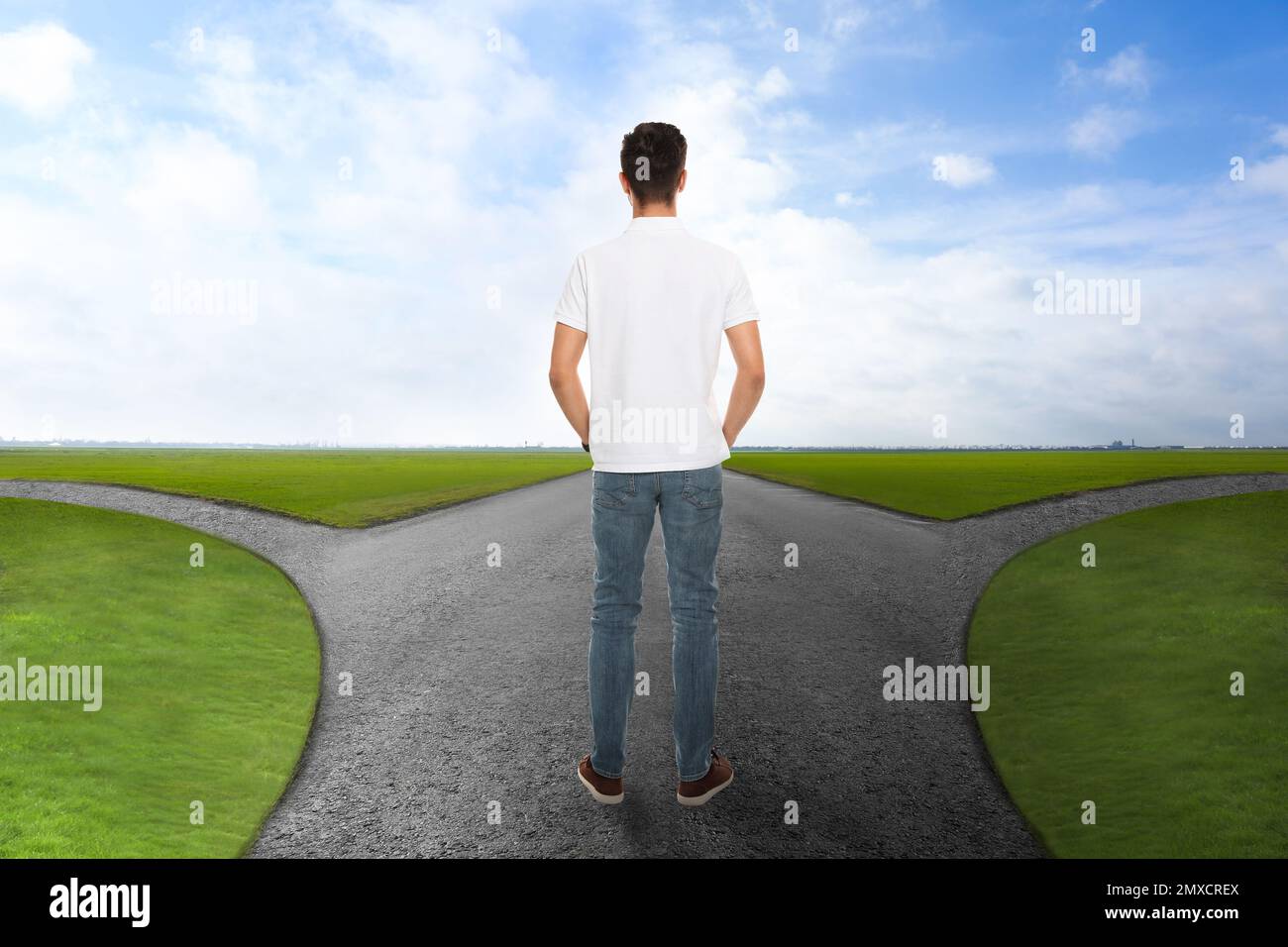 Man standing at crossroads. Concept of choice between different ways