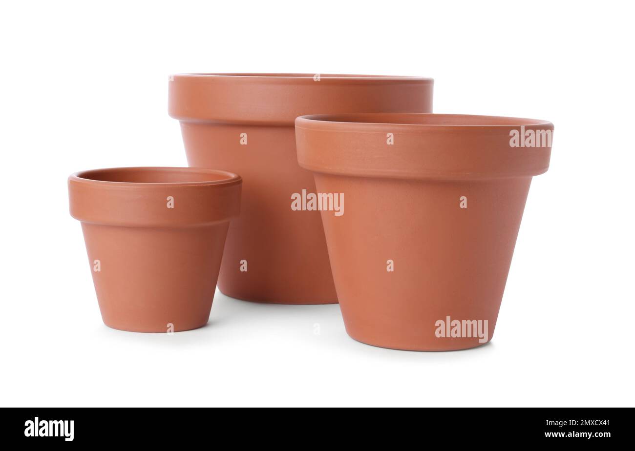 Stylish terracotta flower pots isolated on white Stock Photo - Alamy