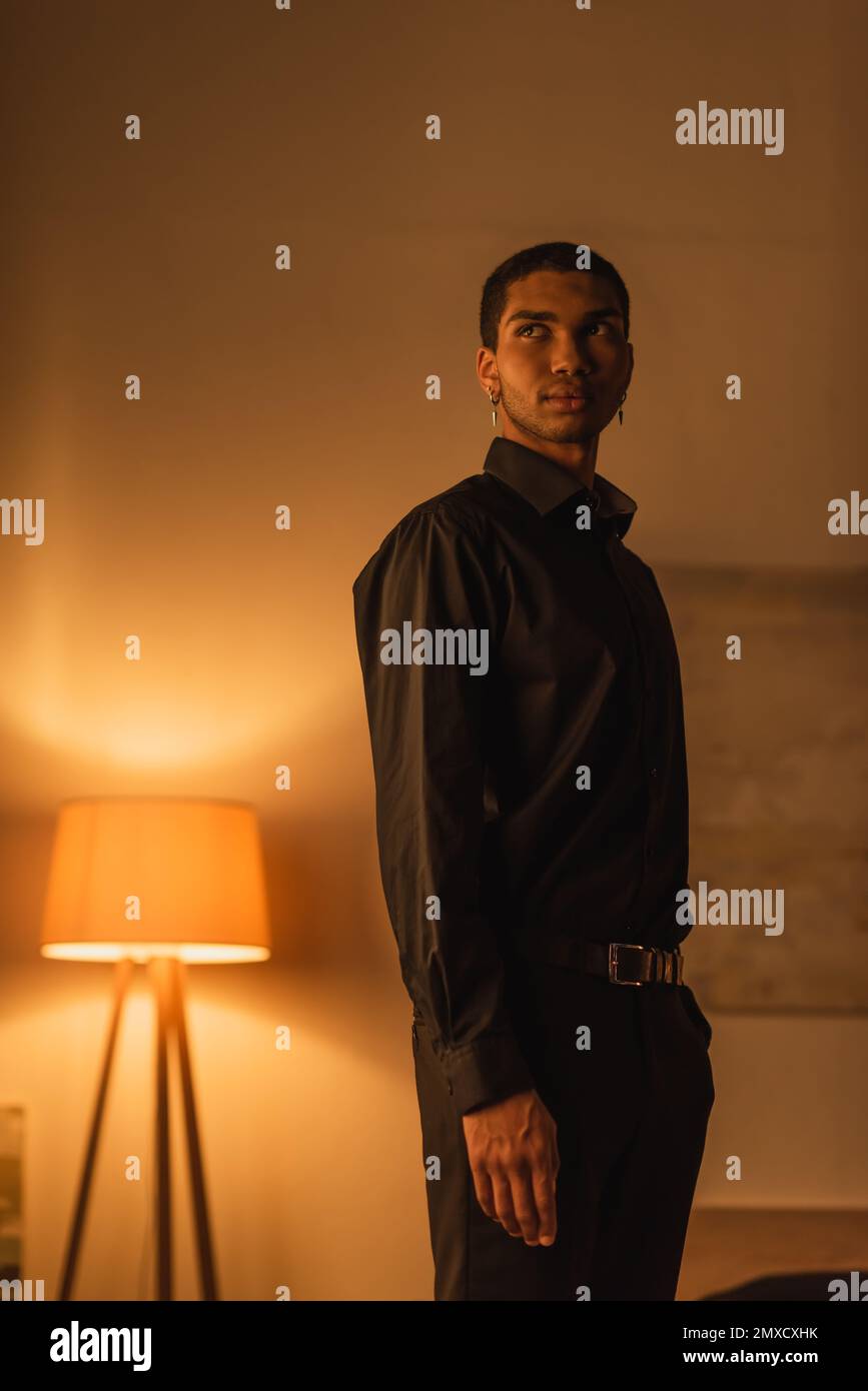 Man in black clothes hi-res stock photography and images - Alamy