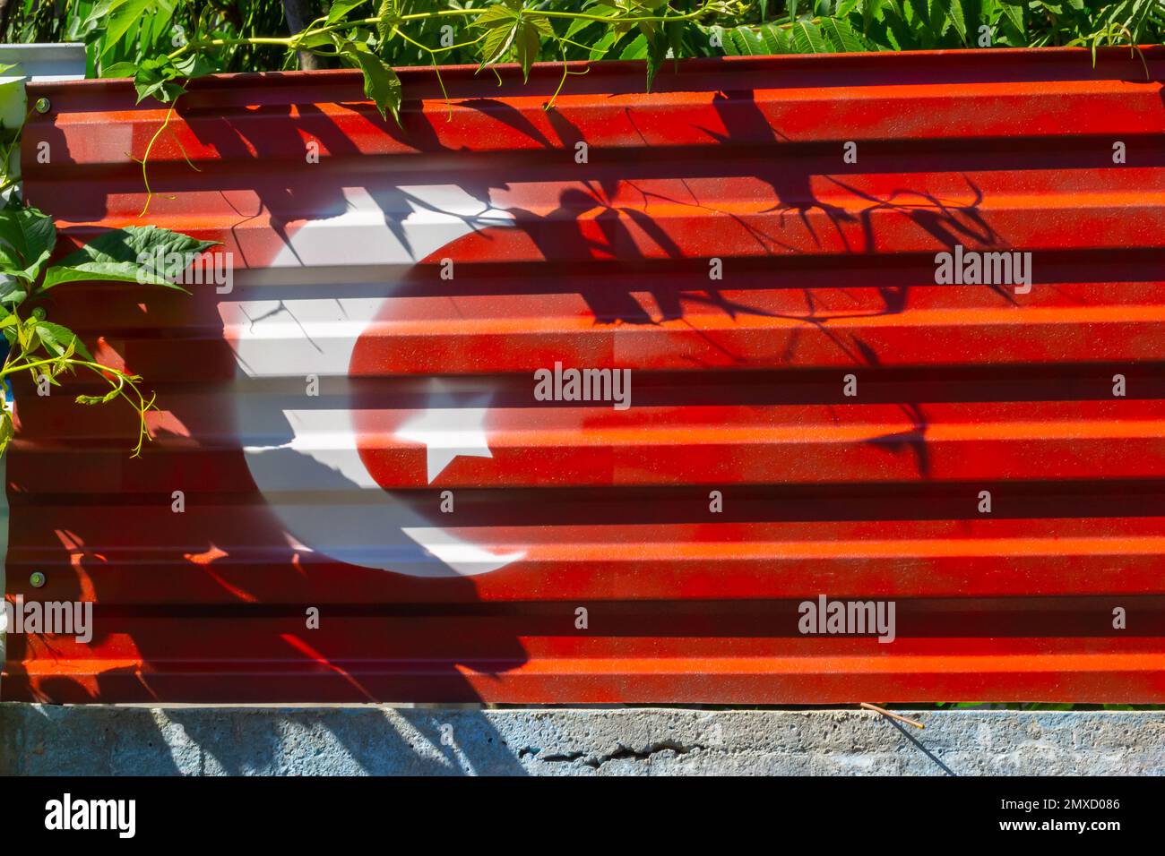Textured flag of Turkiye on grunge metal texture background. Stock Photo