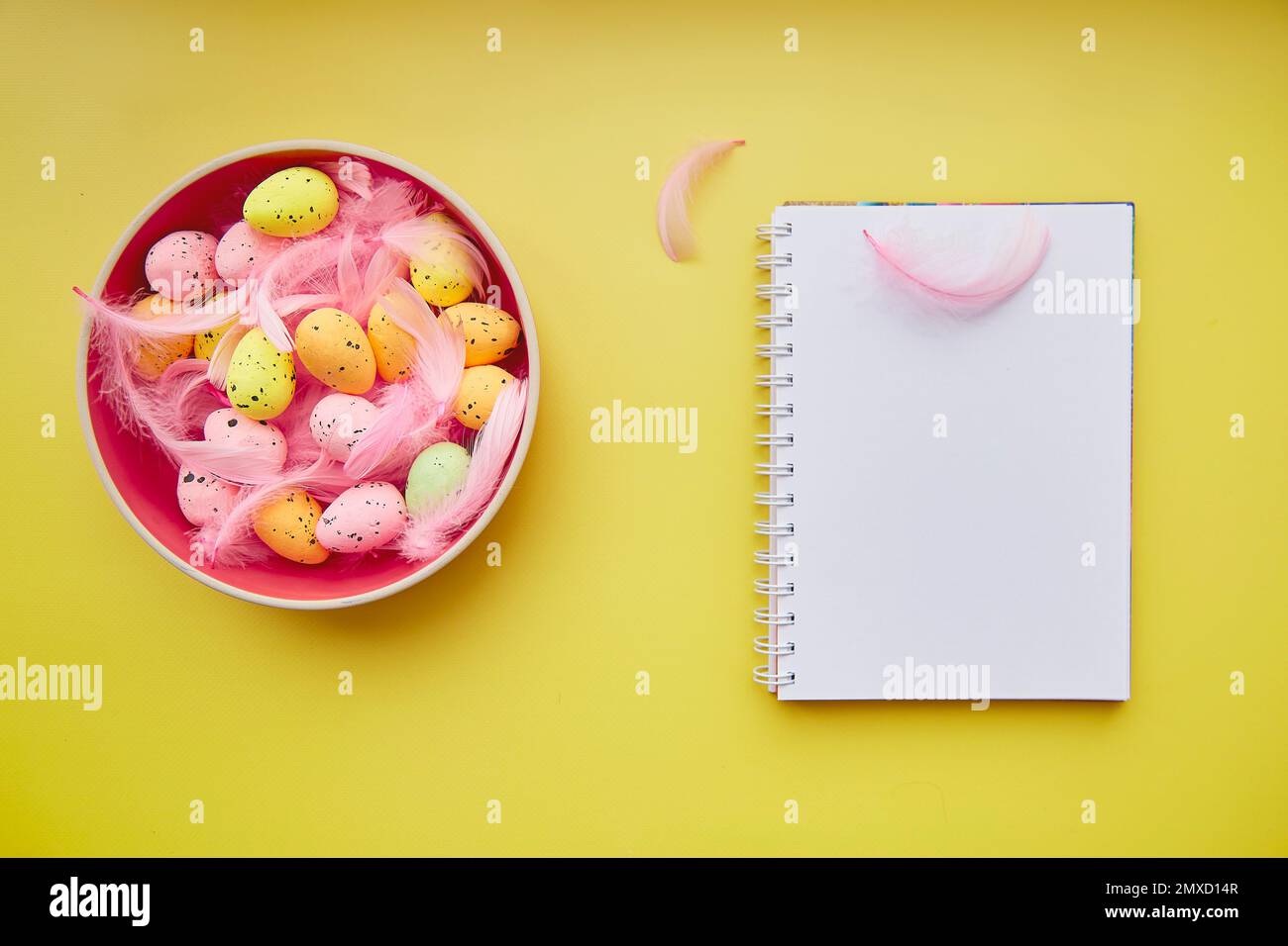 Minimalist Easter notepad mock up on yellow background. Pink bowl with ...