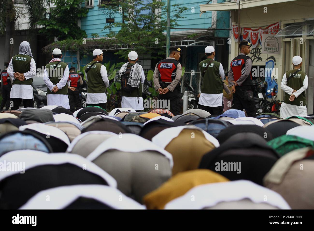 February 3, 2023, Yogyakarta, Special Region of Yogyakarta, Indonesia: Indonesian Muslims perform congregational prayers during a protest in Yogyakarta. The demonstrations were held in protest against the burning of the Quran by Swedish-Danish right-wing politician Rasmus Paludan, in Sweden, and the tearing of pages of the Quran by Edwin Wagensveld, leader of the Dutch anti-Islam group Pegida, in The Hague. (Credit Image: © Angga Budhiyanto/ZUMA Press Wire) EDITORIAL USAGE ONLY! Not for Commercial USAGE! Stock Photo