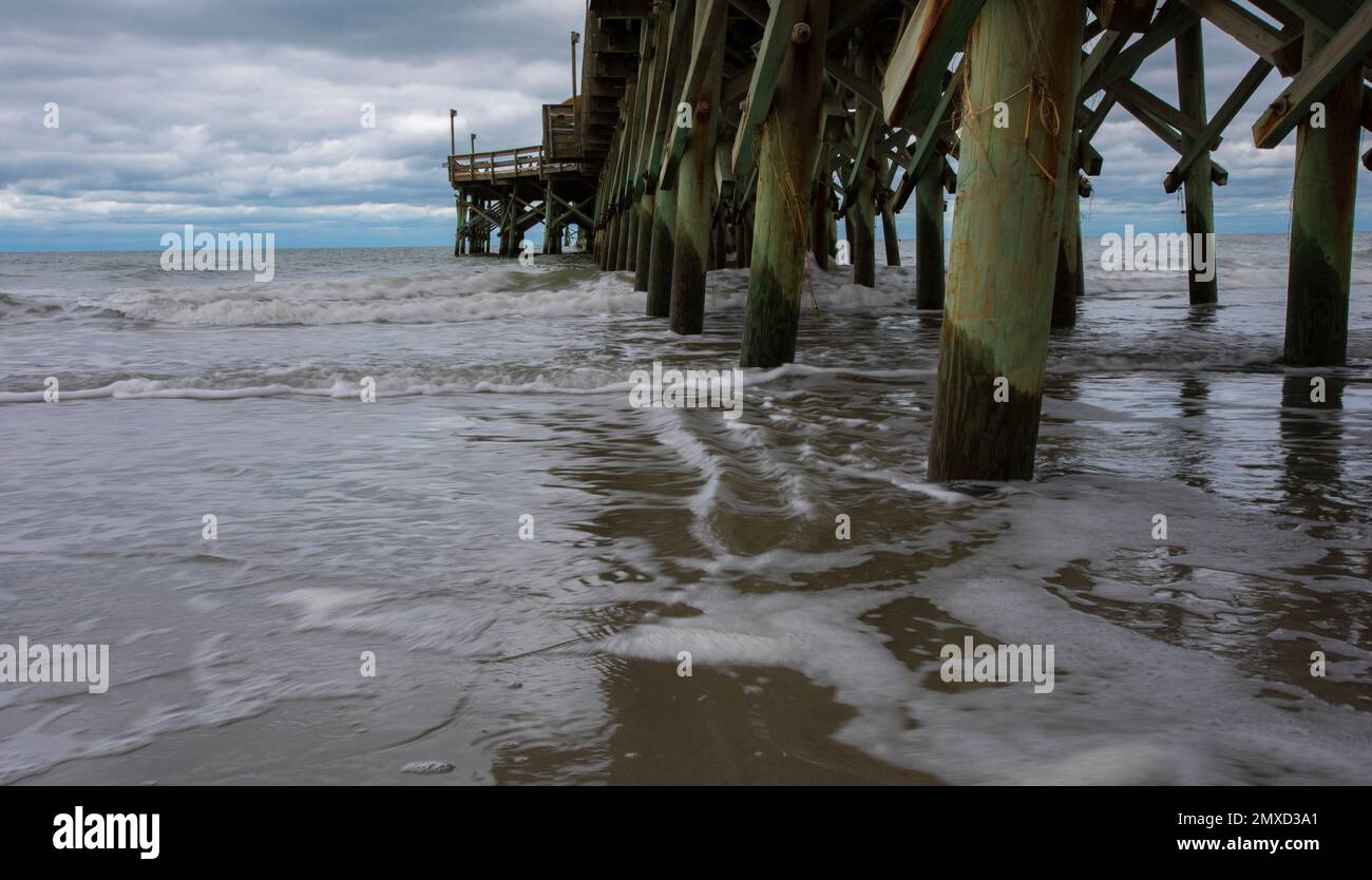 Tide coming in under a pier at Myrtle Beach in South Carolina Stock