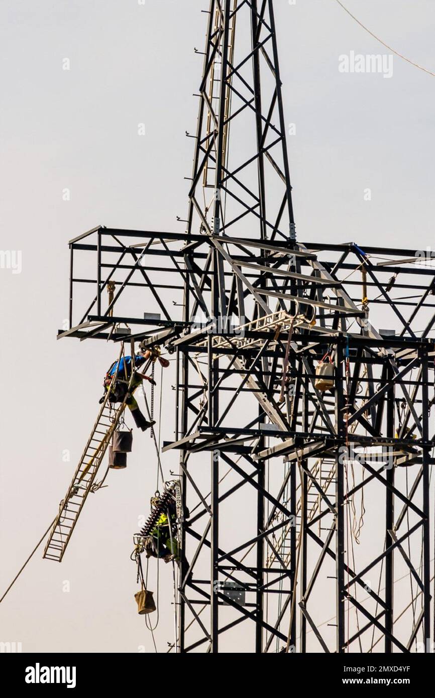 construction of a new highvoltage power line, workers on electricity pylons, Austria Stock