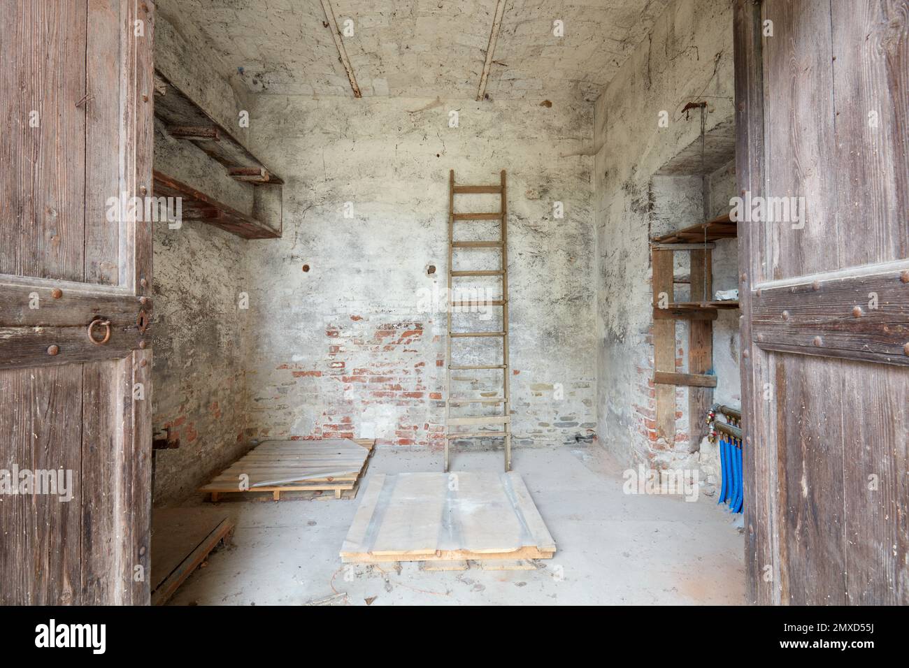 Old storage room with wooden portal in old country house Stock Photo