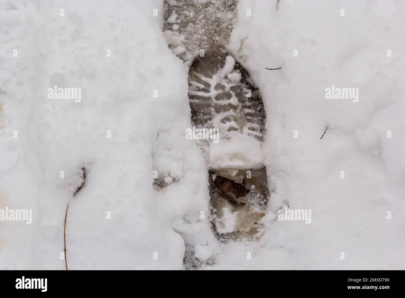 elevated view of footprint on snow covered ground. Stock Photo