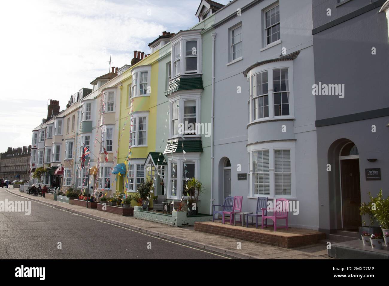 Colourful houses on the beach front in Weymouth, Dorset in the UK Stock