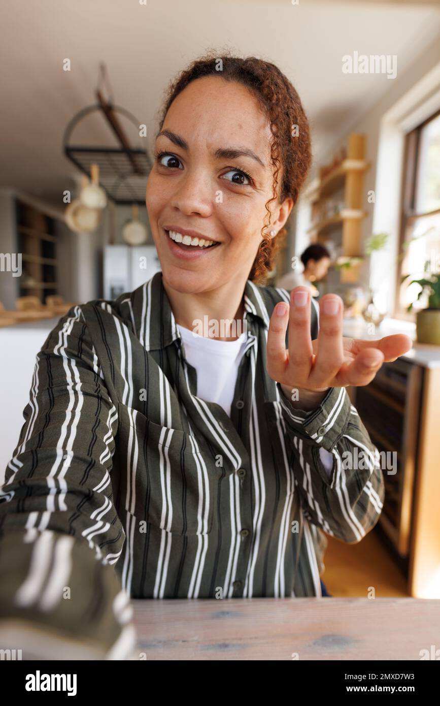 Happy biracial woman having video call Stock Photo