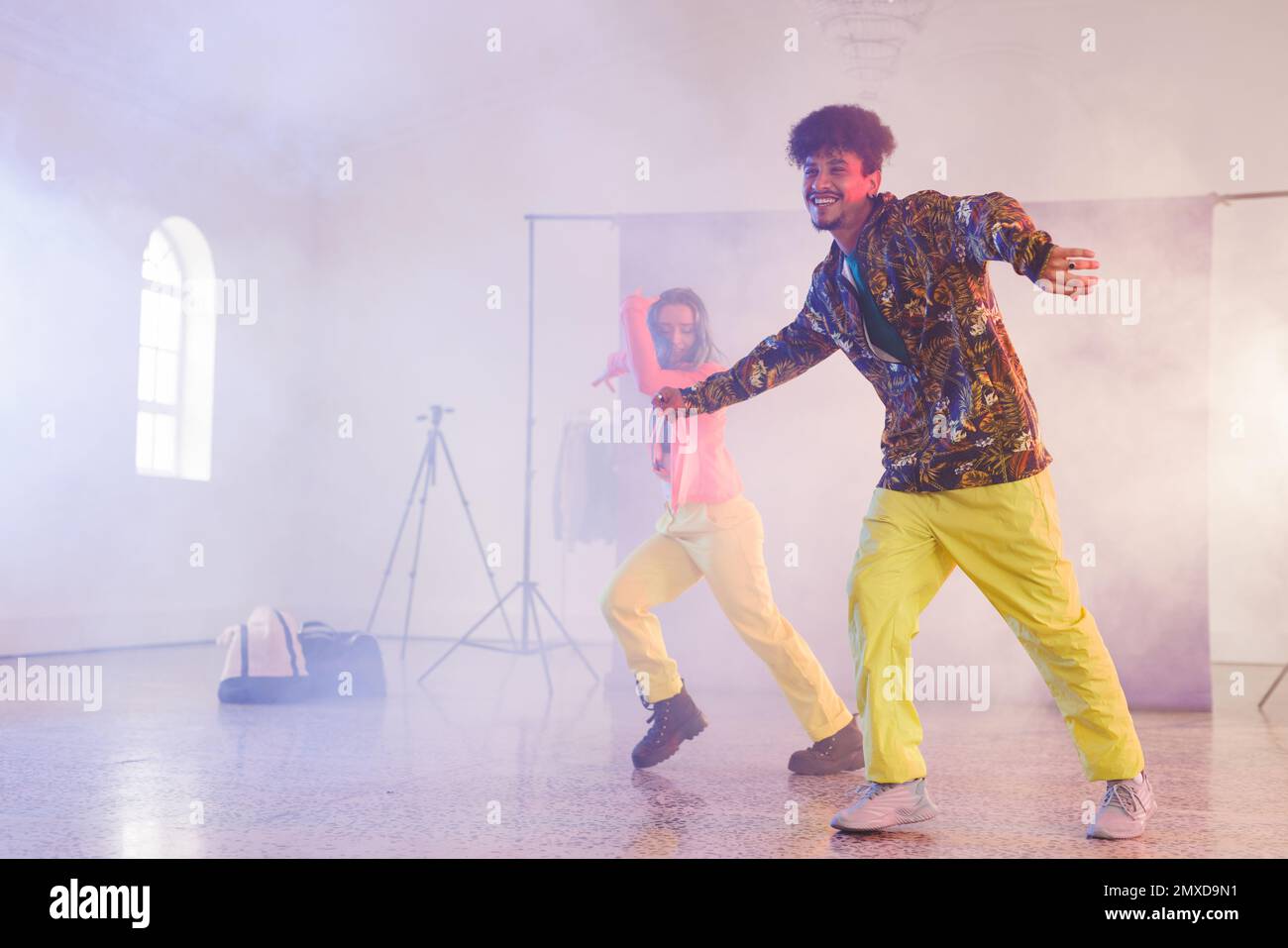 Image of happy diverse female and male hip hop dancers in studio. Dance, rhythm, movement and training concept. Stock Photo