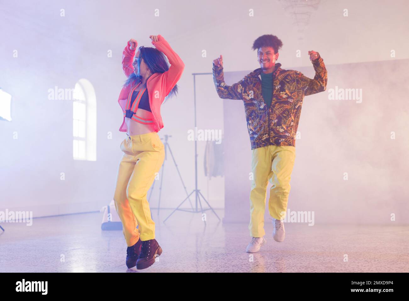 Image of happy diverse female and male hip hop dancers in studio. Dance, rhythm, movement and training concept. Stock Photo