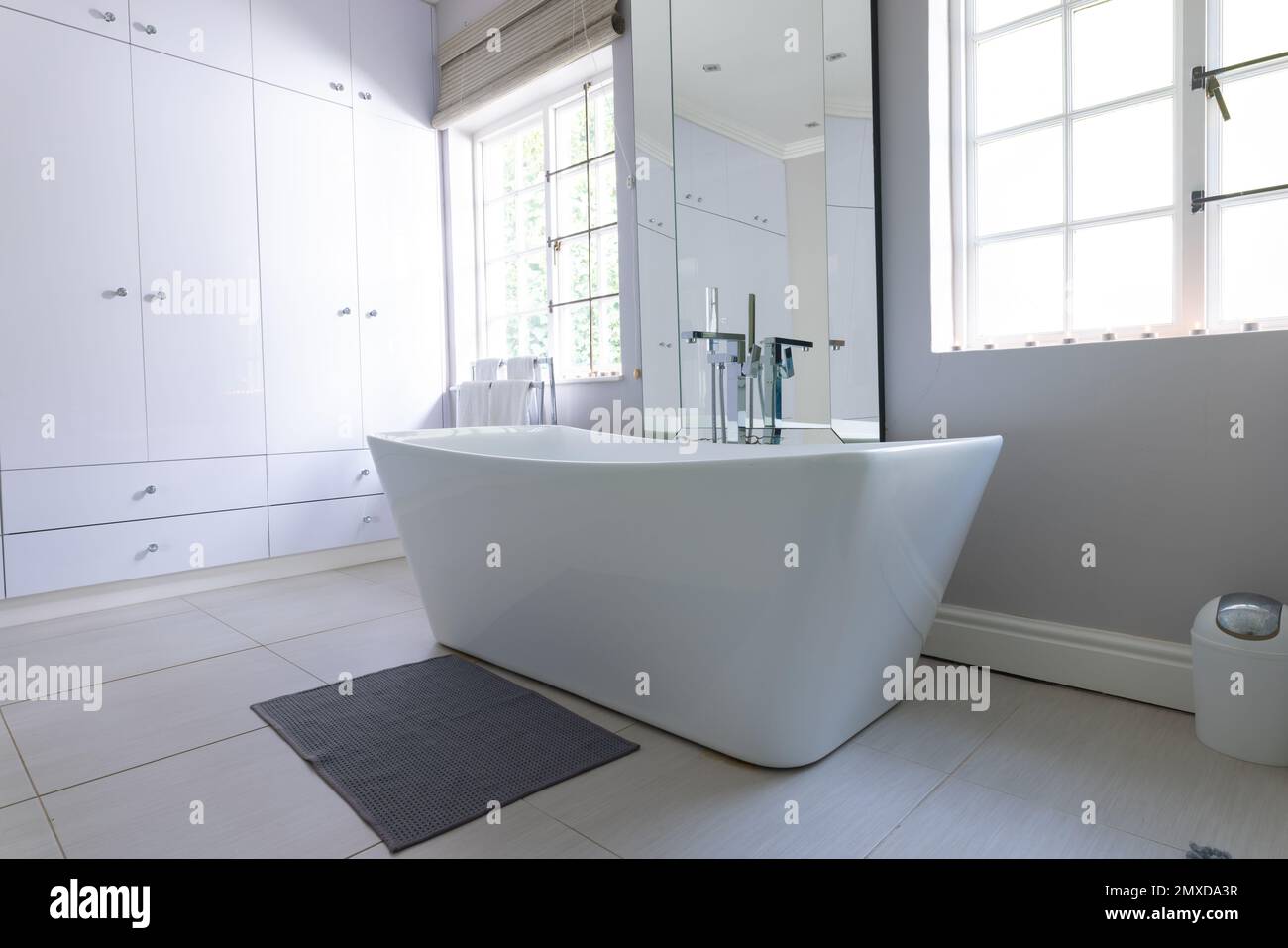 Free standing bath in luxury modern bathroom at home, with copy space ...
