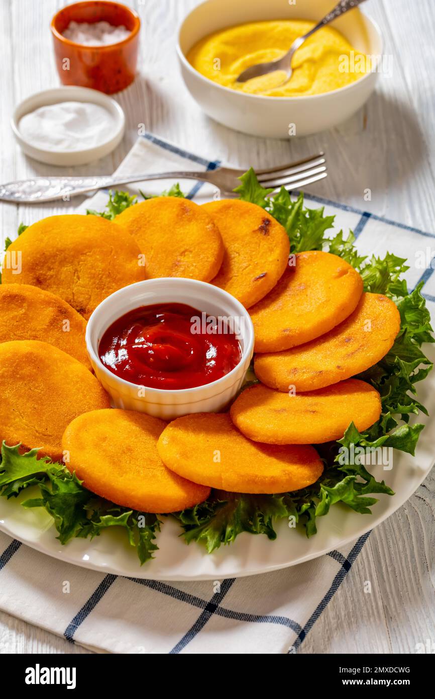 Hot Water Cornbread, corn pones, hoecakes, corn dodgers on plate with ...