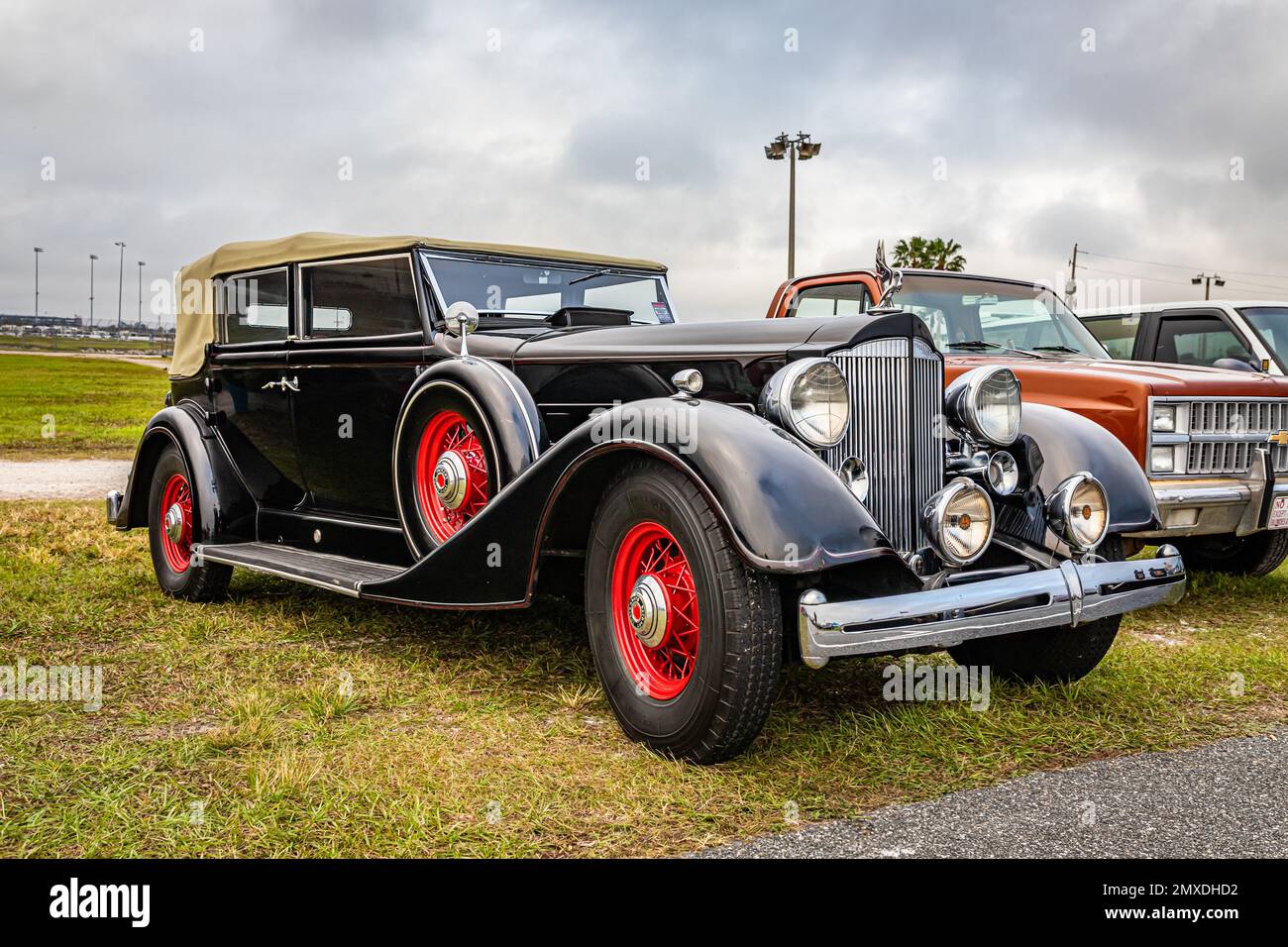 Daytona Beach, FL - November 26, 2022: Low perspective front corner view of a 1934 Packard Super Eight Convertible Sedan at a local car show. Stock Photo