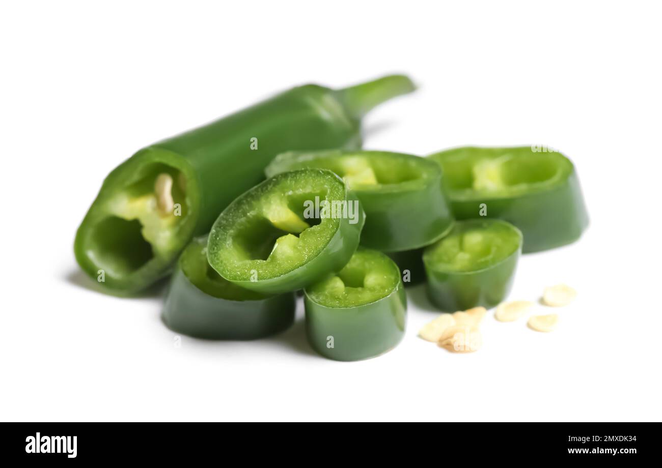 Cut green hot chili pepper on white background Stock Photo - Alamy