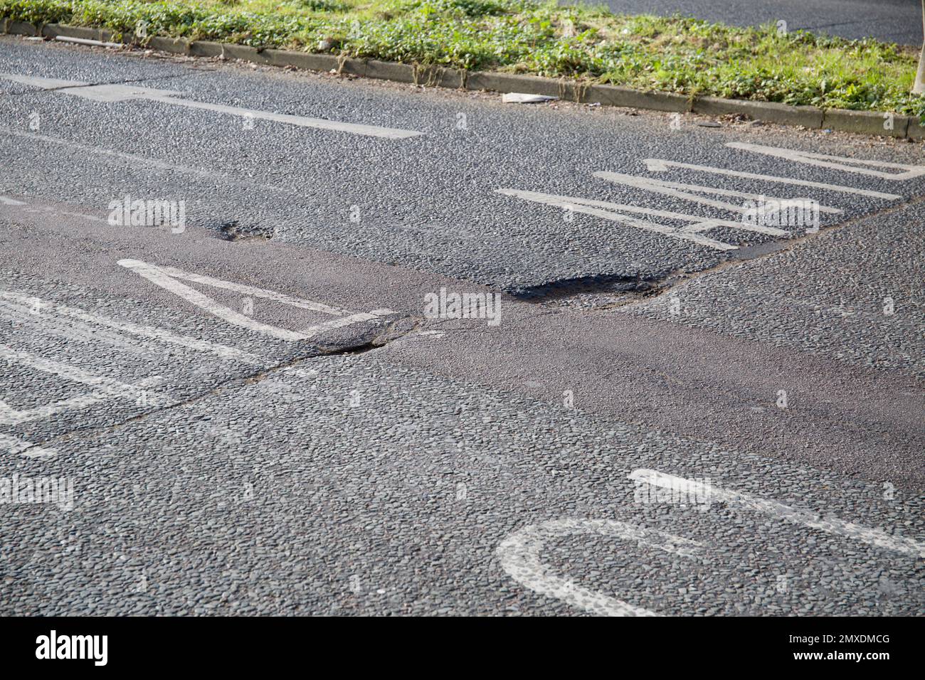 Pot Holes Pothole in Road A414 Church Langley Roundabout Harlow Essex Stock Photo
