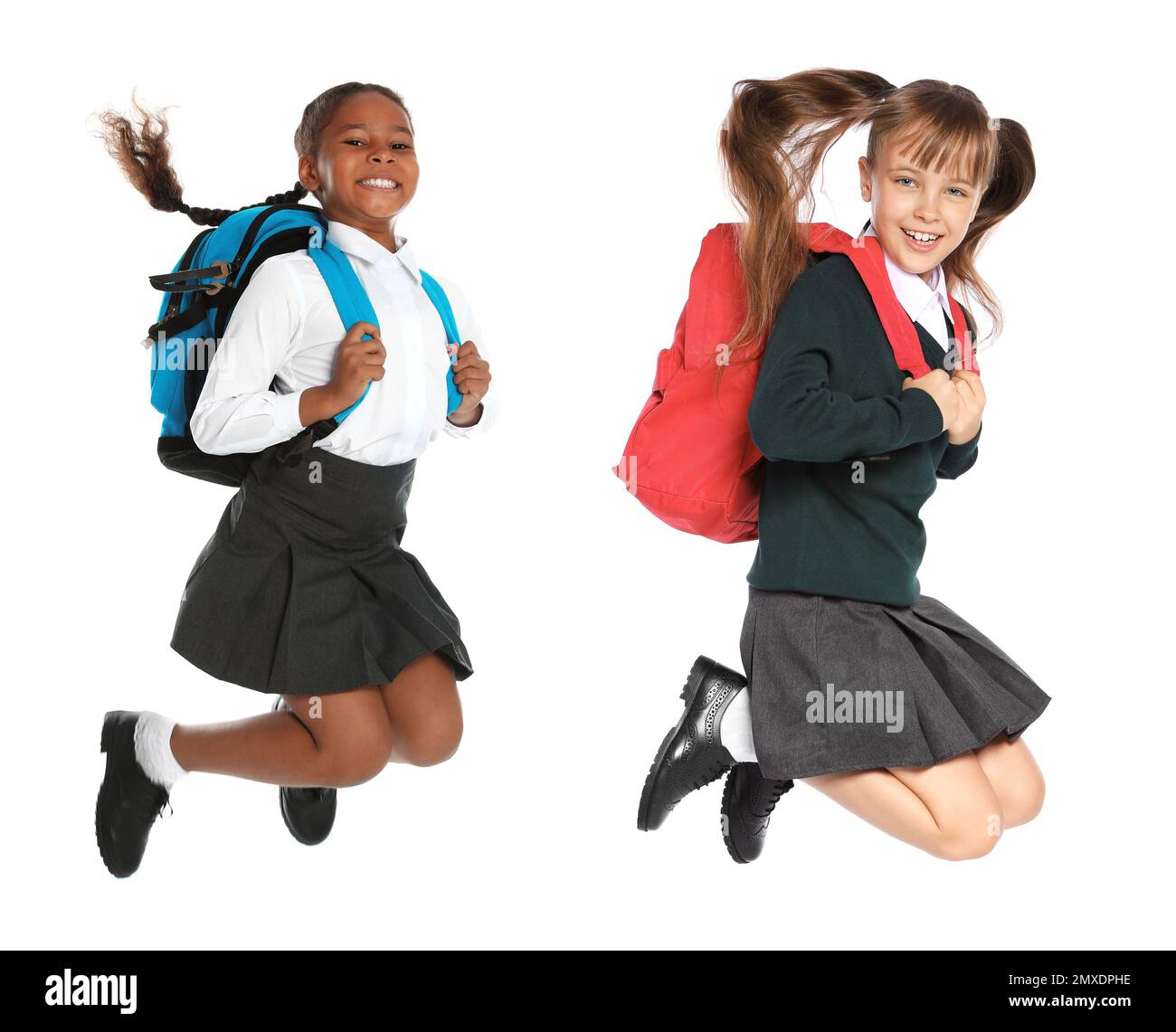 Children In School Uniform Jumping On White Background Stock Photo Alamy