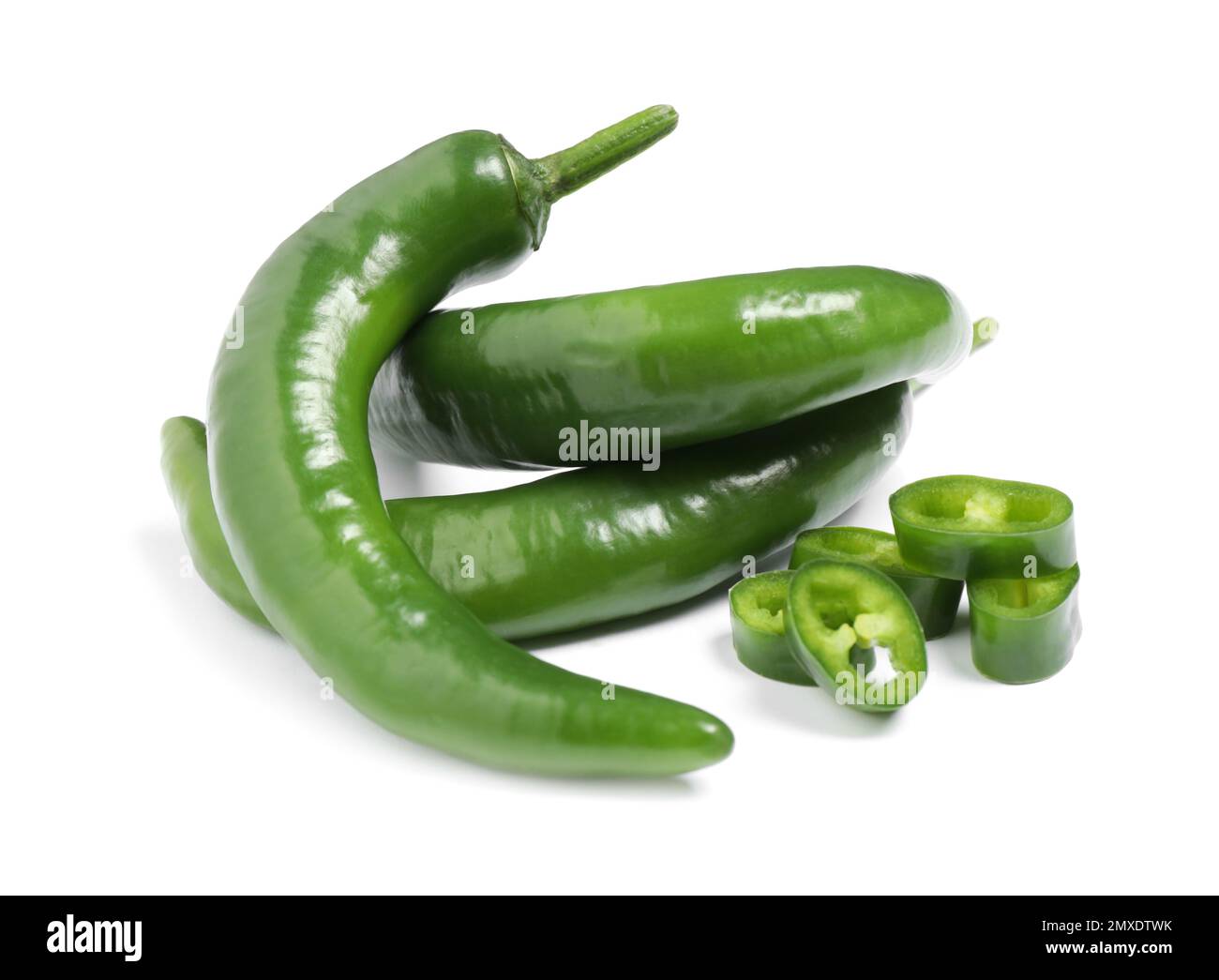 Cut and whole green hot chili peppers on white background Stock Photo ...