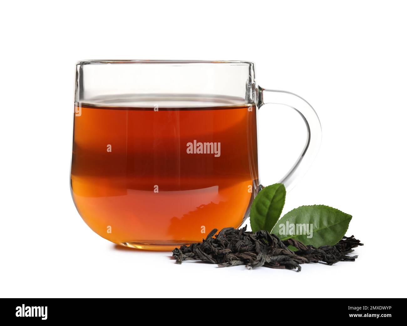 Tasty black tea with fresh and dry leaves on white background Stock