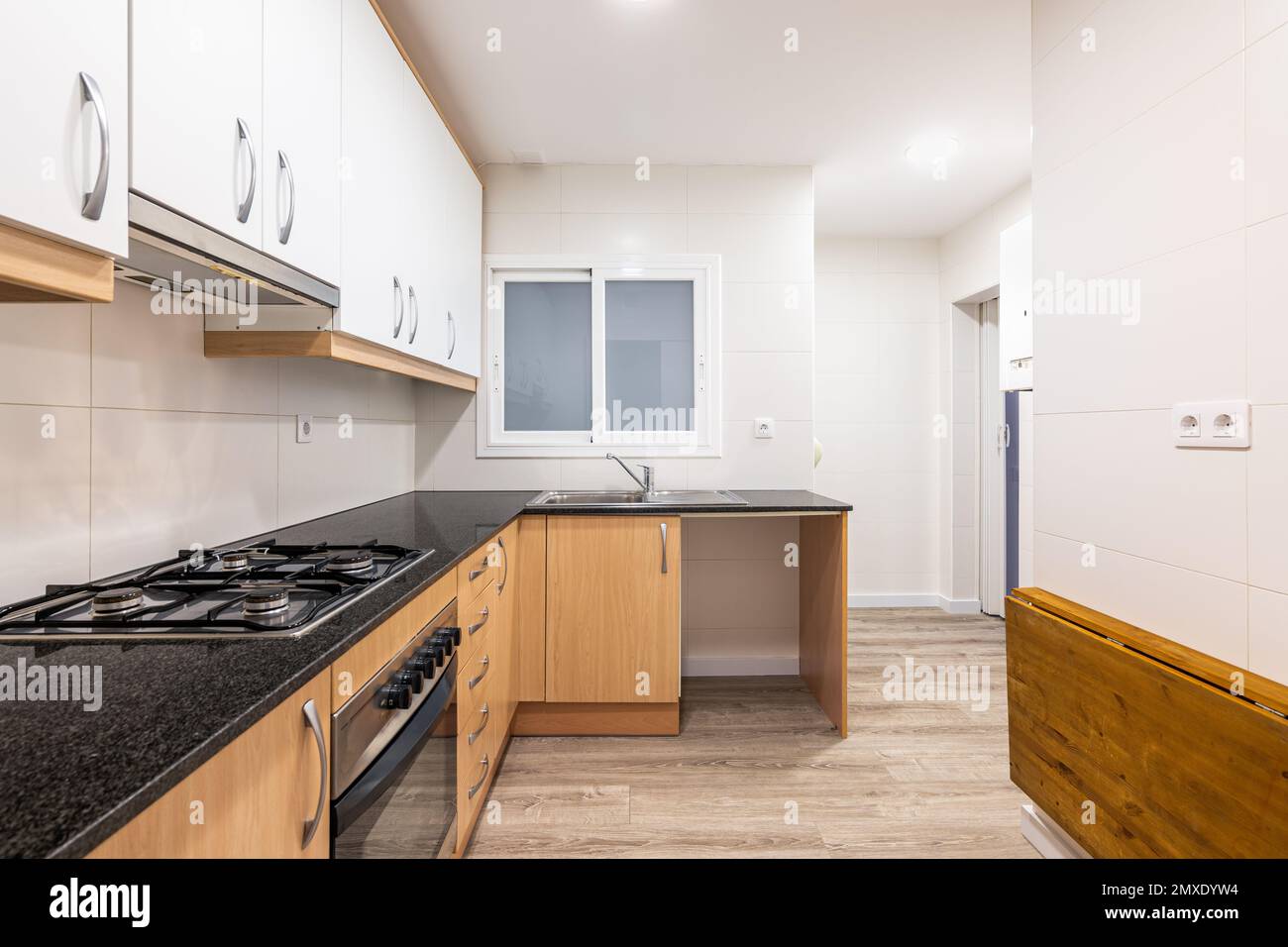 Modular furniture in kitchen with white on top of wall and