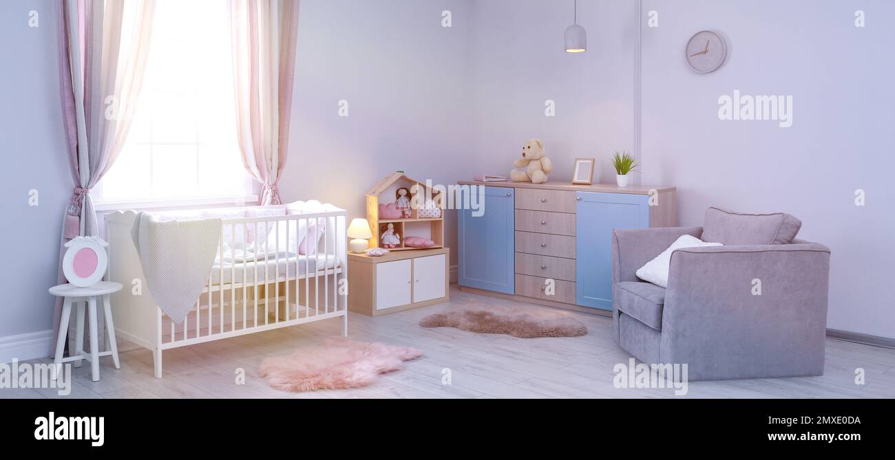 Baby room interior with comfortable crib near window. Banner design